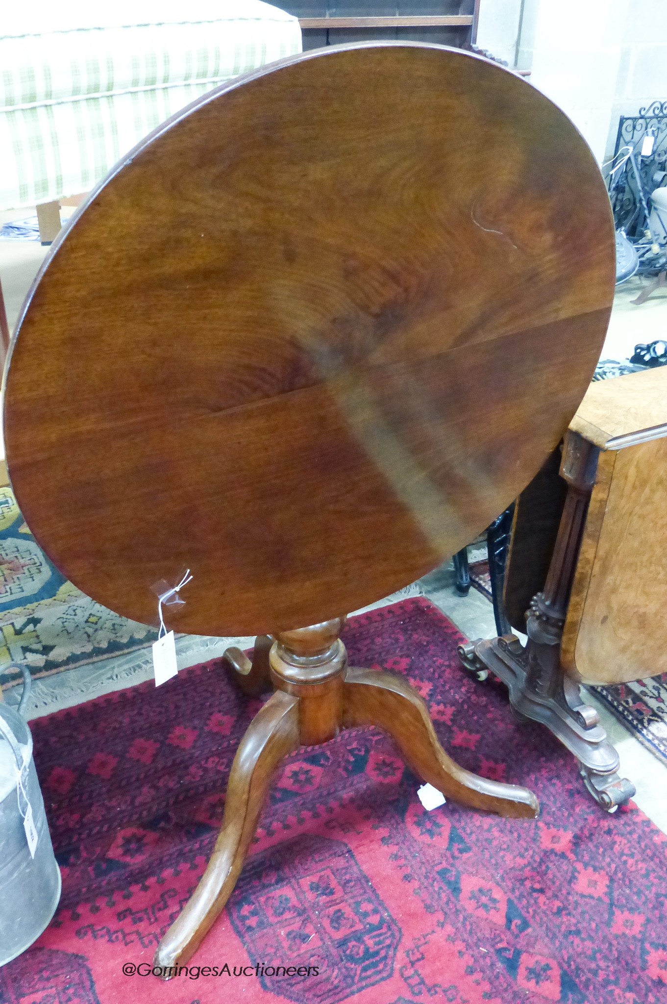 A Victorian mahogany tilt top tea table. D-75, H-73cm.